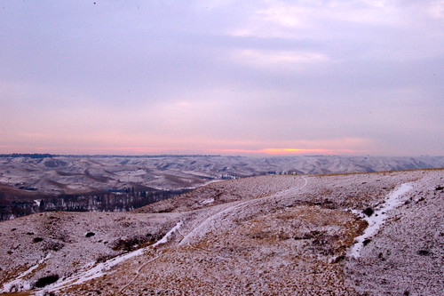 old winter snow man sunrise river valley lethbridge coulees