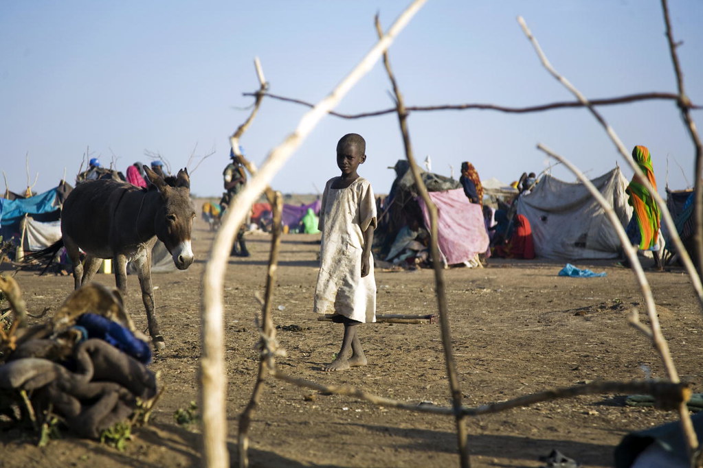 Displaced Sudanese Face Harsh Conditions | A young girl is p… | Flickr