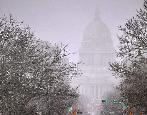 Capitol Looms Over Downtown Madison on a Snowy Afternoon by Madison Guy