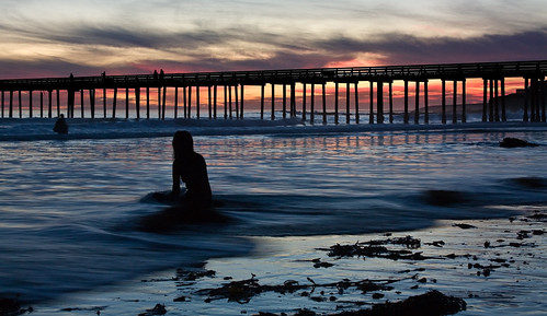 Engulfed by the surf by Rob DeGraff, She just sat there while Beth Sargent, Mary & I just snapped away...and the incoming tide rolled