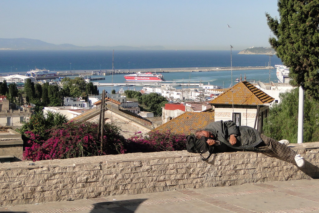 Homeless Man Sleeps Overlooking Tangier Bay - Tangier, Morocco