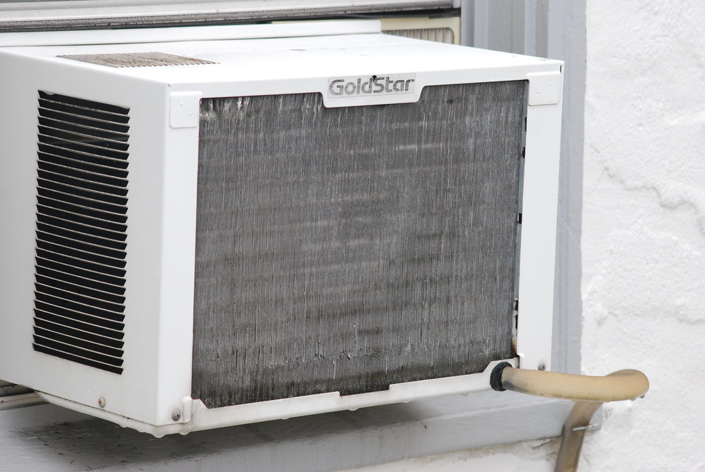 Outdoor air-conditioning condenser units beside a building