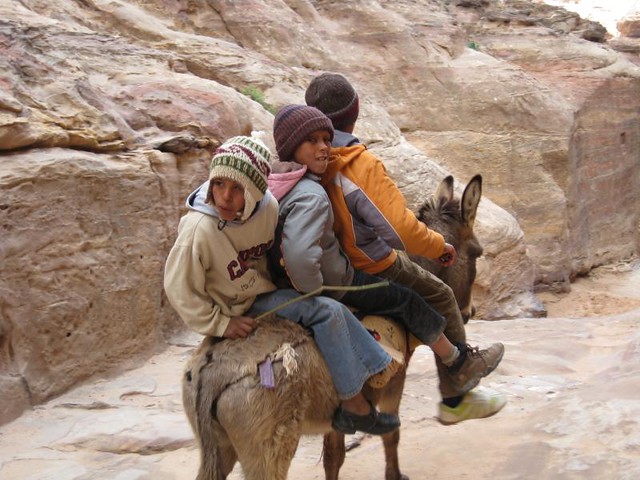 Jordan, riding a donkey in Petra