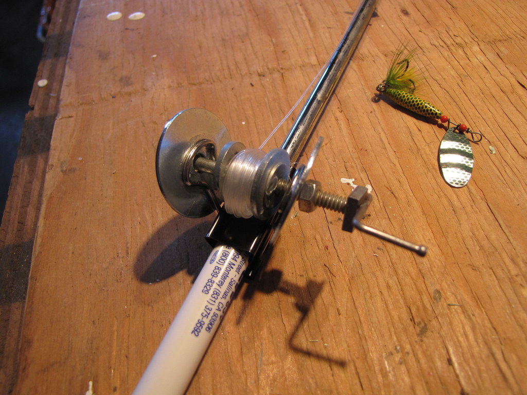 DIY Portable fishing rod project, Close-up of the reel, mad…