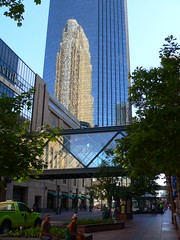 Reflection of Wells Fargo Center on IDS Center and the Minneapolis skyway system