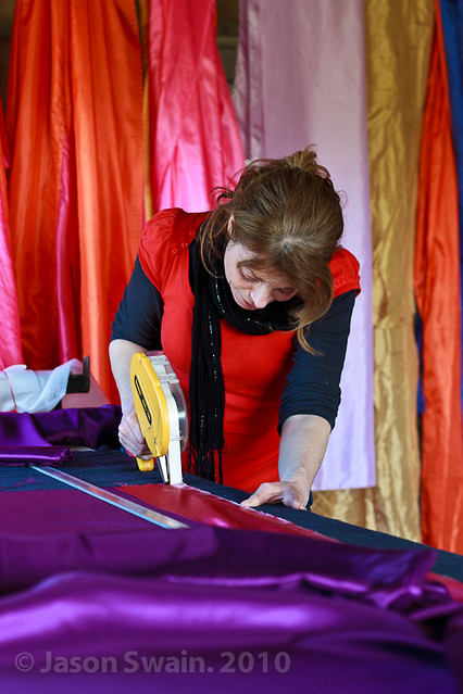 Artisan. Woman working with colourful fabrics #1