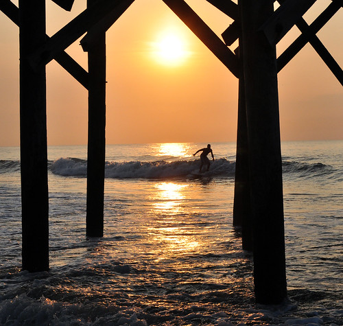 ocean sea reflection sc water silhouette sunrise pier surf surfer southcarolina wave pawleysisland explored