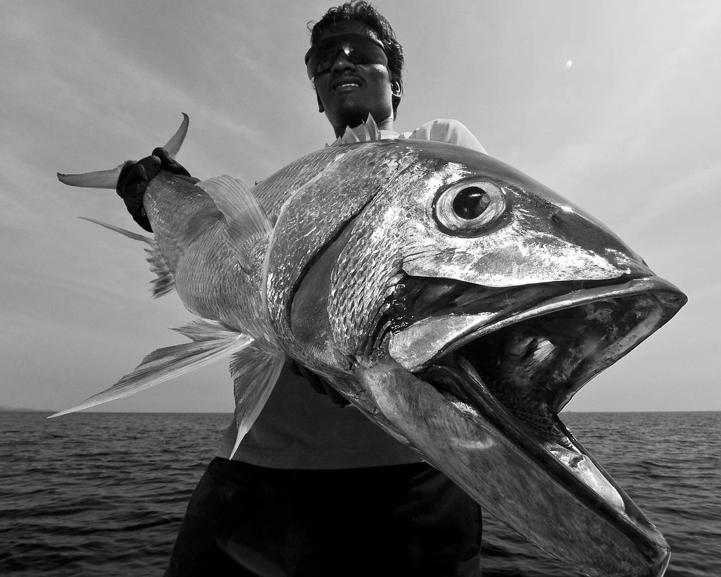 Andaman Islands, India. Portrait of a fisherman with a Rusty Jobfish. Lit with an SB800 with Lumiquest pocket bouncer. Edited in B&W