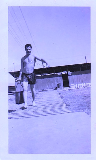 1950s Shirtless Man On Beach With Water Pail vintage photo