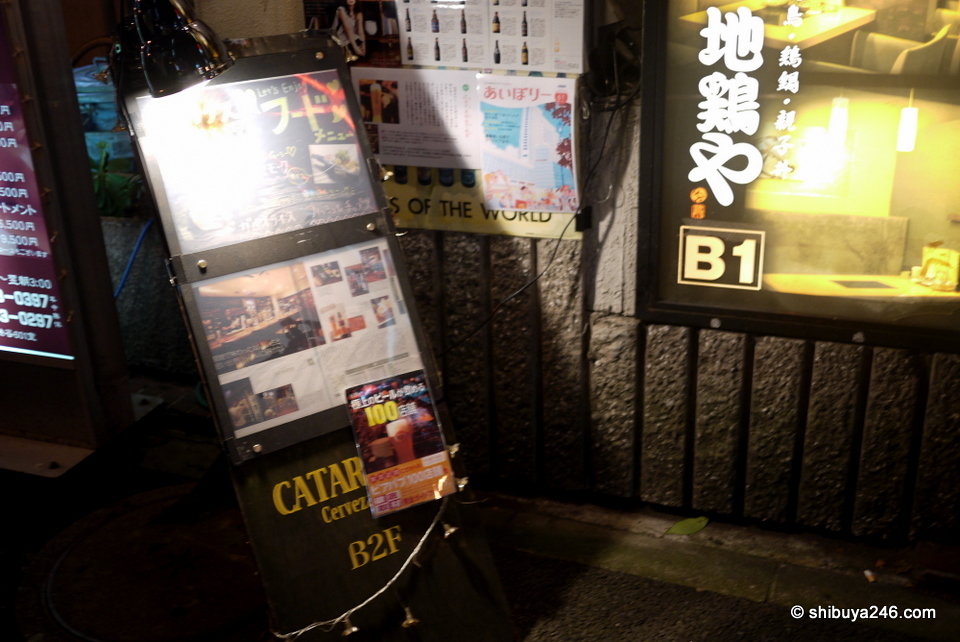 The signboard outside competes with the other restaurants and bars