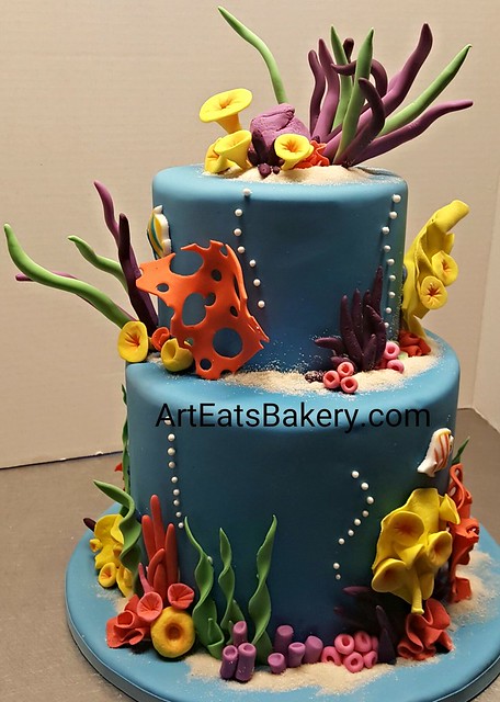 Under the sea kids birthday cake with edible sand, coral, tropical fish and sea grass. The mom put Nemo and Dory toys on at the party. #cake #greenvillesc #nemo #birthday #dory #cakedecorating #iongreenville #kids #bakery #customcakes #food http://www.art