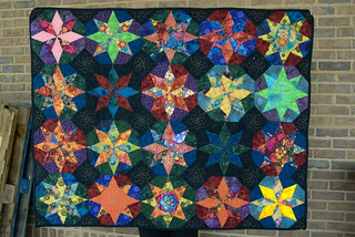 ...and here it is! it's ready to mail, go off, and have another life off on the west coast.

Blog entry: domesticat.net/quilts/chaos-theory