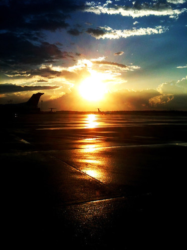 sunset rain clouds gold airport iah