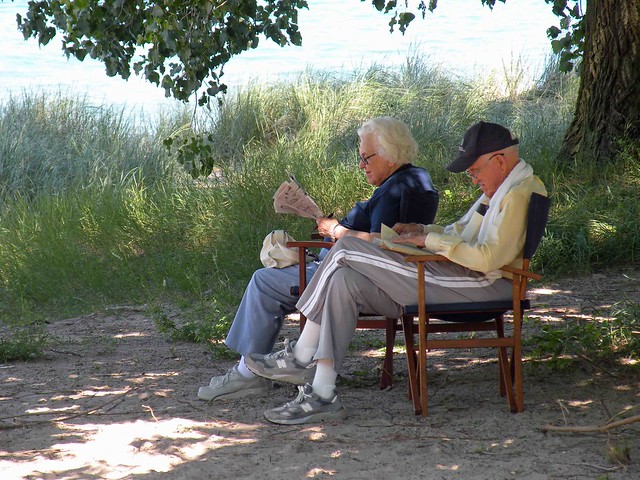 Couple reading in the shade