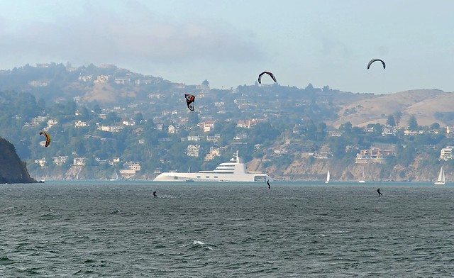 windsurfers and a yacht named 'a'