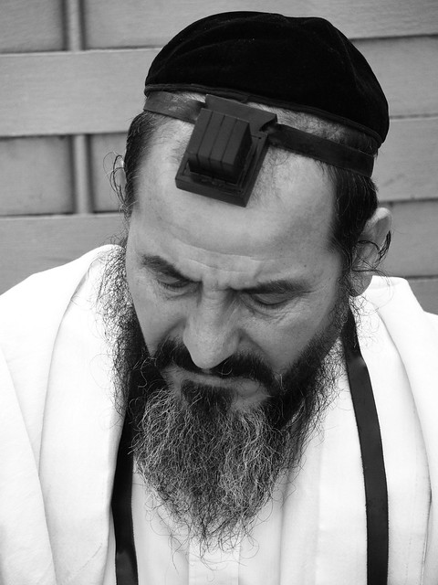 Jewish man at the Western wall in Jerusalem praying