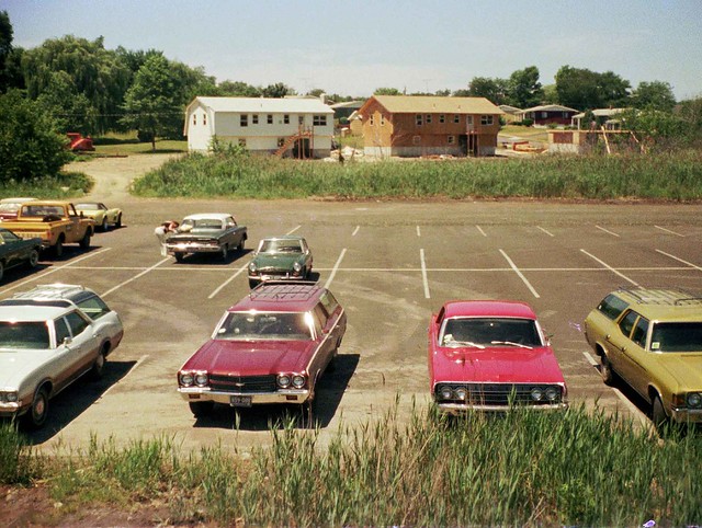 A new & improved scan of one of my faves. So many colorful 1970s cars in the Surf Club parking lot from the top of a playground slide to new houses on Seabreeze Ave. Milford Connecticut. July 1974