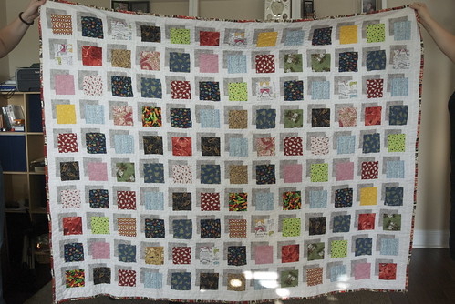 A straight-up photo of the finished Red Librarian quilt. I kept this one; it's my spare winter quilt and the fabrics are a massive in-joke for me.

Bonus: find the NSFW fabric. It's all over the quilt. Blog entry: domesticat.net/quilts/red-librarian