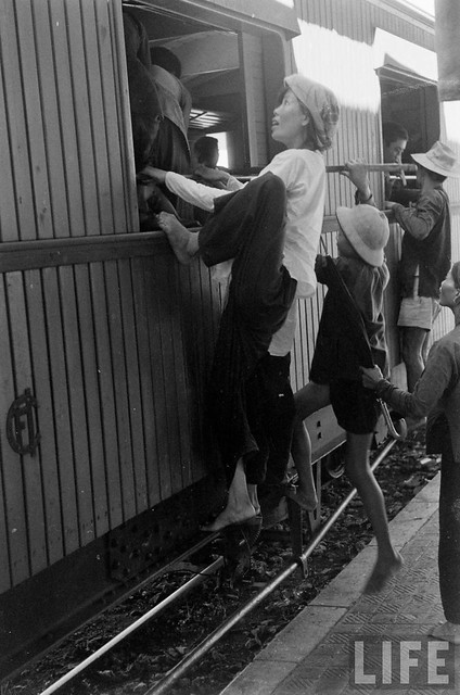 Hanoi residents climbing into train to flee south after Communist takeover 1954