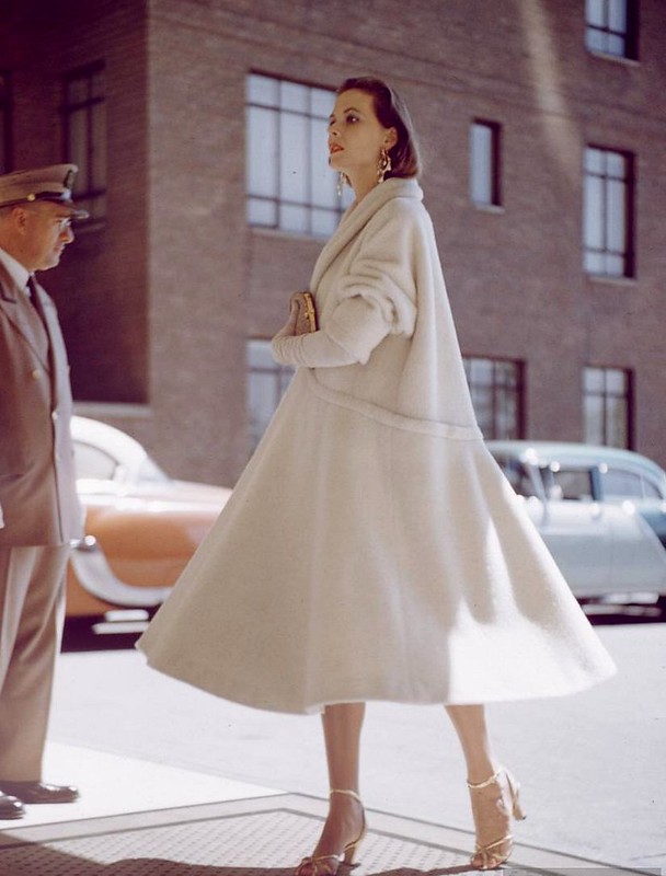 White wool swing coat with push-up sleeves, 1954, photo by Nina Leen