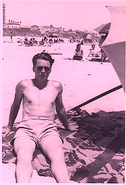 1950s Shirtless Man On Beach In Swim Trunks Shorts Umbrella