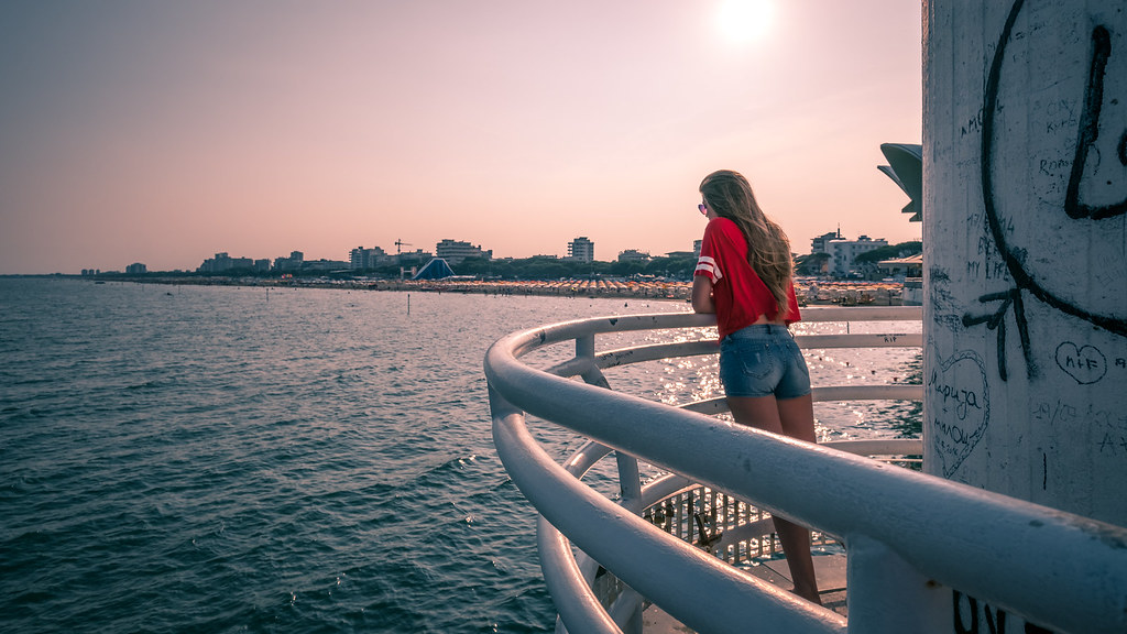 The girl in red - Lignano sabbiadoro, Italy - Color street photography
