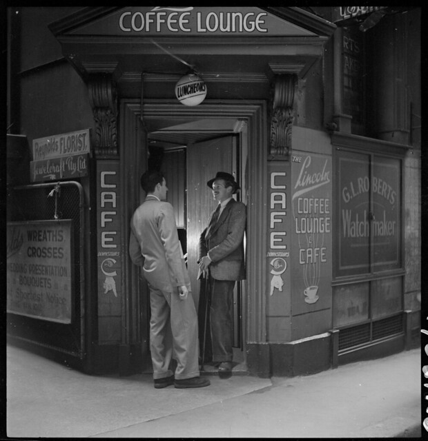 Dick Gooding (on right of door) from Lincoln Coffee Lounge & Cafe, Rowe Street, Sydney / photographed by Brian Bird c. 1948-1951