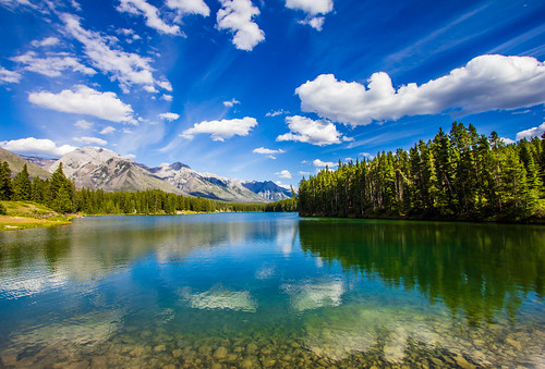 travel blue sky mountain lake canada mountains reflection tree green nature water rock pinetree clouds canon landscape eos nationalpark colorful peace cloudy hiking smooth relaxing rocky peaceful wideangle canadian clear shore alberta valley northamerica translucent banff layers usm transparent dslr digitalrebel relaxed photoart efs 1022mm digitalslr pinetrees province firtree waterscape artisticphotography superwideangle partlycloudy multipleexposures canadianrockies 10mm canonefs1022mmf3545usm johnsonlake 550d minnewankaloop jimboud t2i jamesboud eos550d kissx4