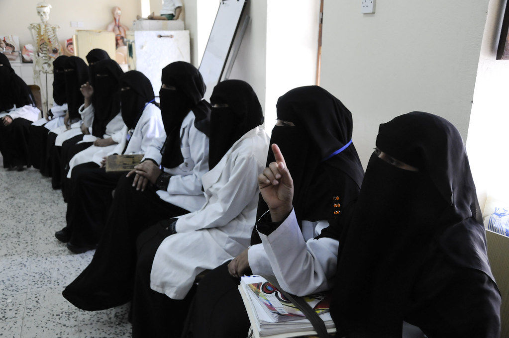 Women attend a class in midwifery at the Health Service Institute