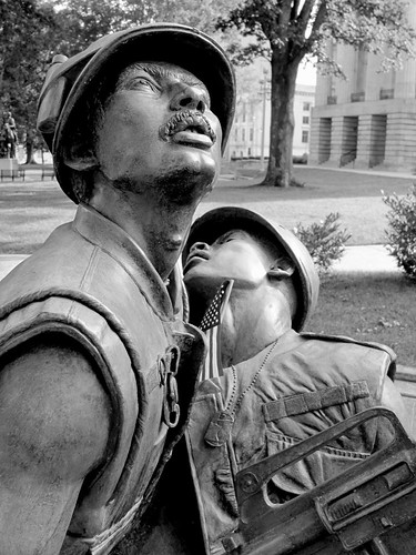 blackandwhite bw sculpture infantry bronze shoes war pants faces wounded knife expressions statues northcarolina raleigh nb equipment soldiers guns canteen grenade emotions figures bandage carry weapons memorialday colfax injured sculpt intheround vietnamveterans abbegodwin