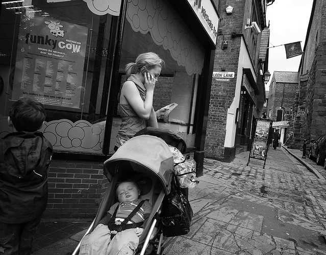 Street Scene: Young Woman, young boy and baby