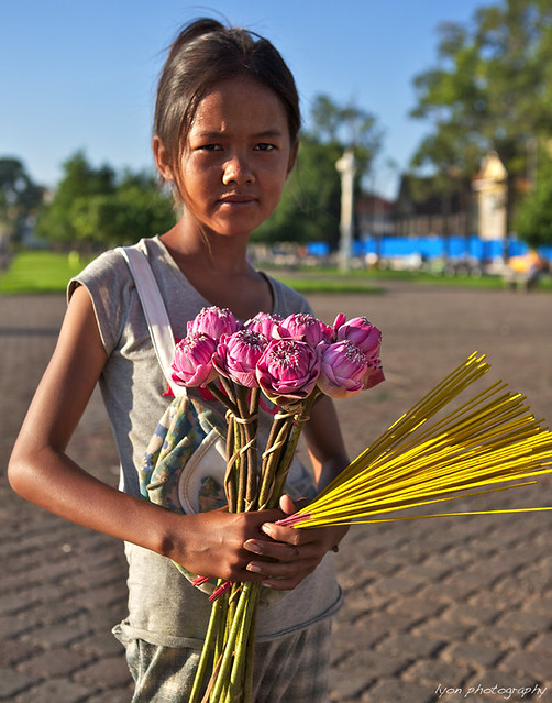 Flower girl with incense - Phnom Penh, Cambodia.