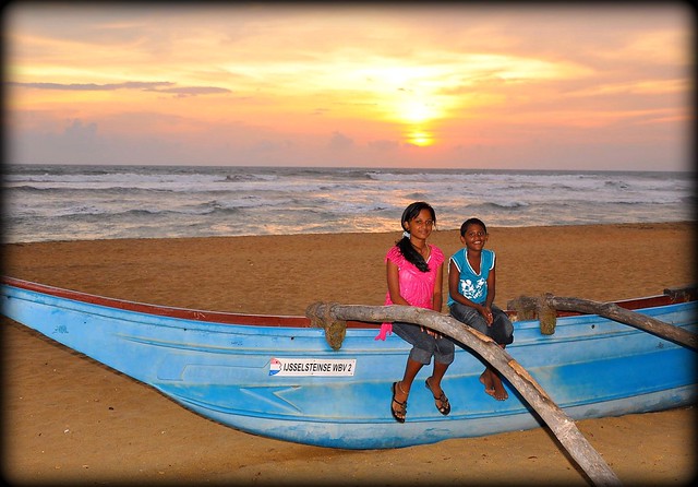 Sri Lankan Kids, boats and a sunset.