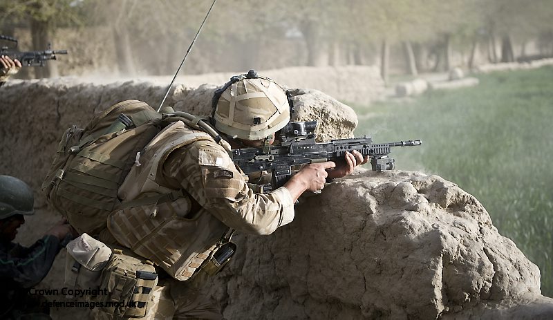 C Company 1 RIFLES soldier Takes up a Firing Position Near Nawa, Afghanistan