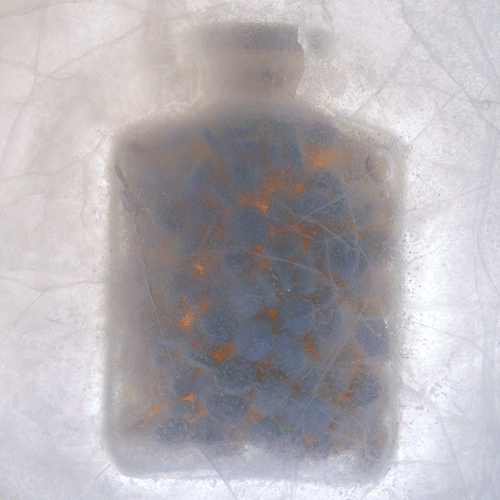 Pill Bottle Frozen In Ice