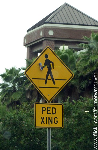 Caution - Pedestrians with Red Bull crossing in crosswalk