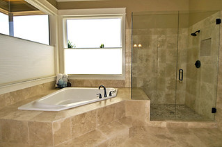 Travertine Bath and Glass Shower | by Sitka Projects LLC