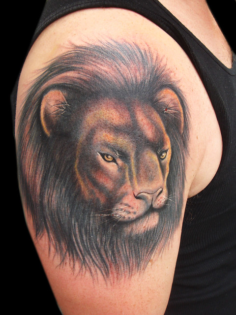 Lion cover up tattoo