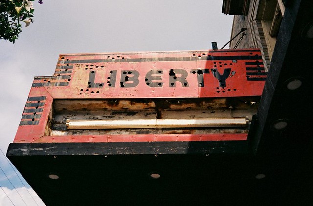 the busted up facade of the Liberty movie theater, Liberty, New York.