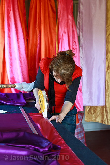 Artisan. Woman working with colourful fabrics #2
