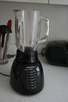 an electrically powered mixer that mixes, chops or liquefies foods