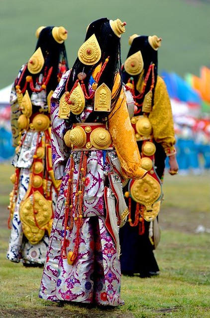 Ornate, massive, pure gold ornaments worn by bejewelled girls at Lithang Horse Festival