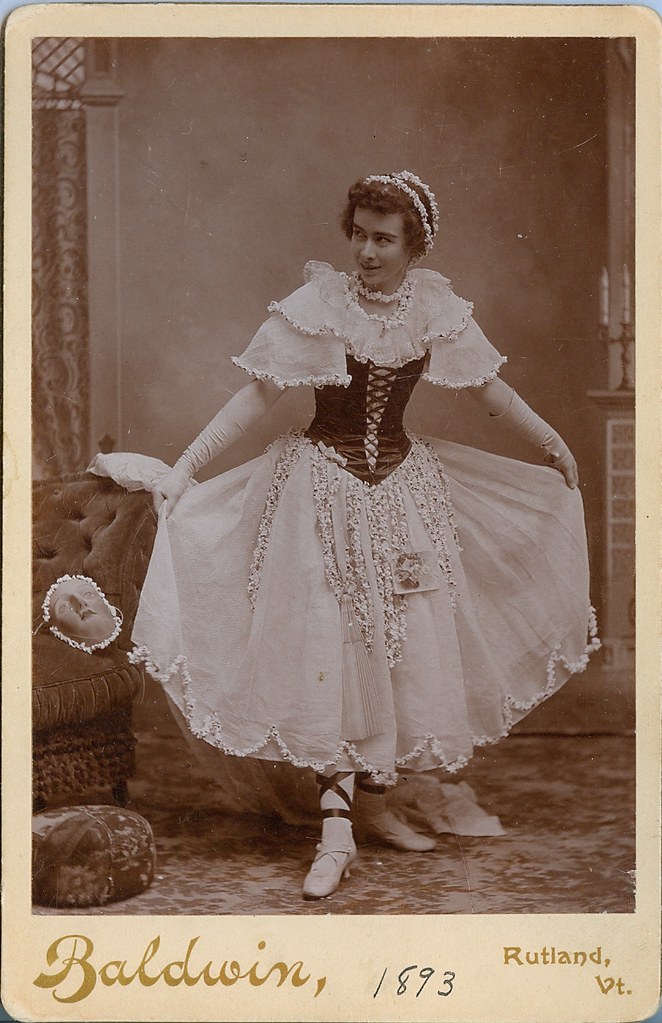 Cabinet photo of a girl returning from a costume party...wearing popcorn