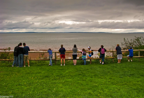 from park cliff canada beach grass clouds danger fence novascotia view ns candid young teens bayoffundy behind railing blomidon provincial eroding actively