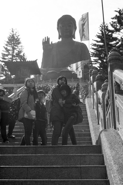 Girls having fun in stairs to Big Buddha