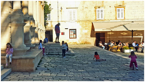 children play cafe outdoorseating plaza croatia hvar candid canon5d city urban outside sunsetlight ngc