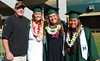 Softball head coach Bob Coolen with graduates Kristin Cheney (student manager), Heather Morales and Ulu Matagiese at UH Manoa’s spring 2017 commencement ceremony at the Stan Sheriff Center on Saturday, May 13, 2017.