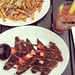 Brunch done right. Brioche French toast with Nutella, maple syrup, and fresh strawberries, along with some Bloody Mary and truffle fries!
