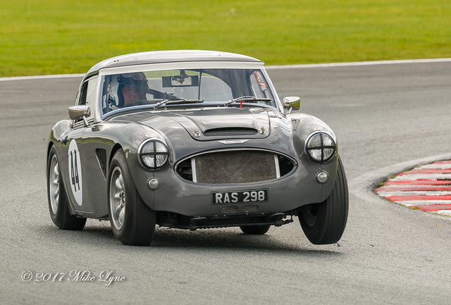 Mike Thorn with his 1961 3 litre Austin-Healey 3000 lifting a front wheel through Hislops Chicane.