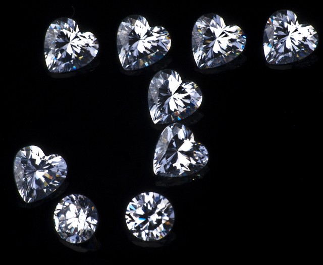 Diamonds Showing Alphabet Letter J - Diamonds on a black bac